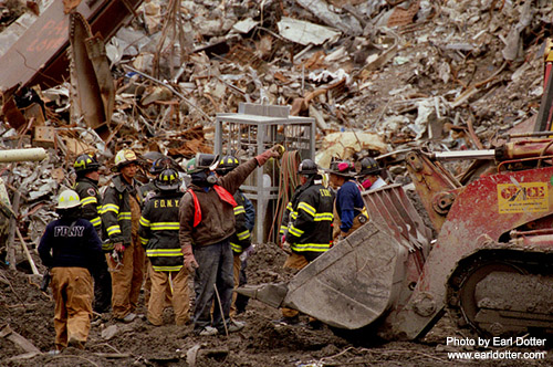 First responders at Ground Zero operate heavy machinery to move rubble and facilitate the search for remains.